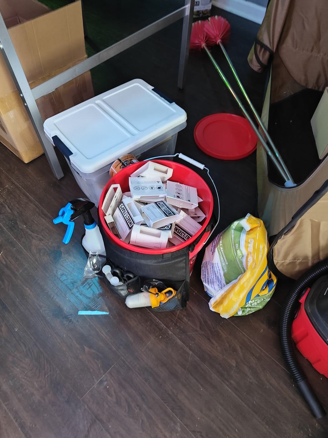 Pest control service bucket with insect traps and tools on a Spring Hill TN job
